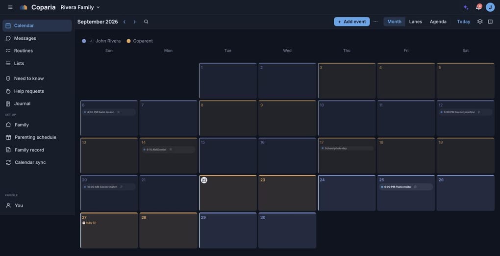 The month view in dark mode, the two home colors lifted so they still read against the dark ground